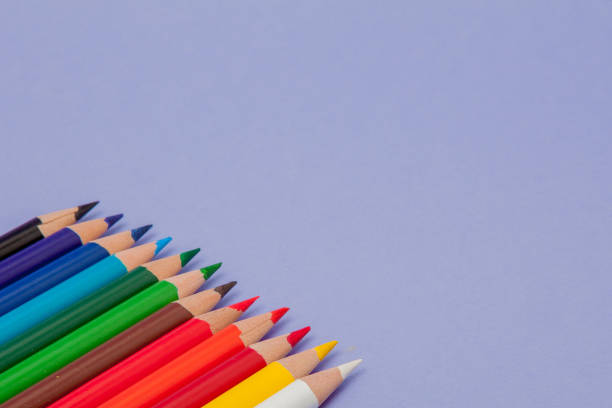 istock Color Pencils on violet Background for Projects and Announcements 1145709173