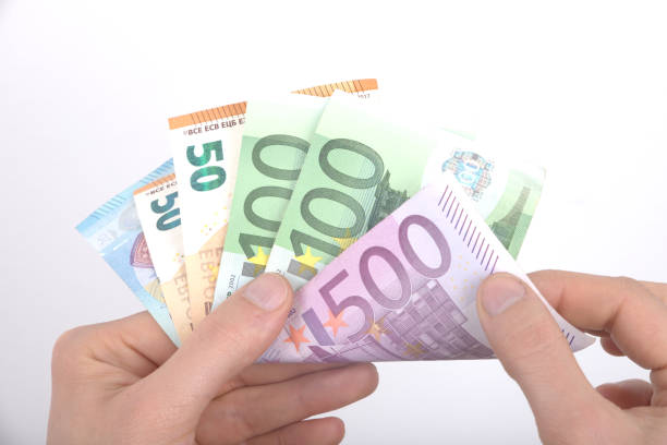 istock High angle view of businessman counting money 1145717010