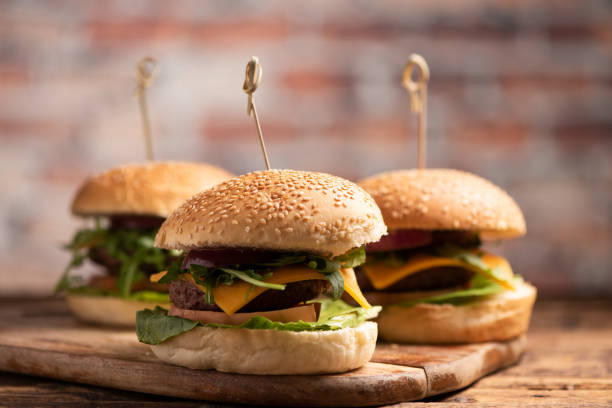 istock hamburger with lettuce, cheddar cheese, onions, tomato 1145717028