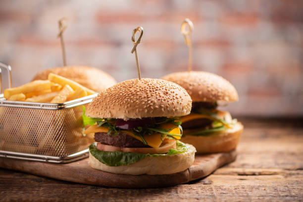istock hamburger with lettuce, cheddar cheese, onions, tomato 1145717114