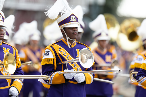 New Orleans, Louisiana, USA - February 23, 2019: Mardi Gras Parade, The Edna Karr High School Marching Cougars, performing at the parade