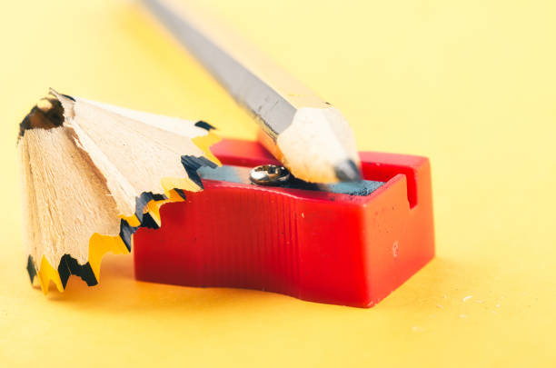 istock Back To school Concept, pencil with it shavings and sharpener over yellow background 1145718947