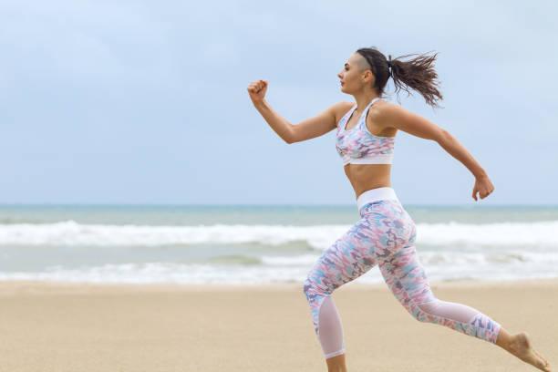 istock Runner Woman Running In The Beach 1145719267