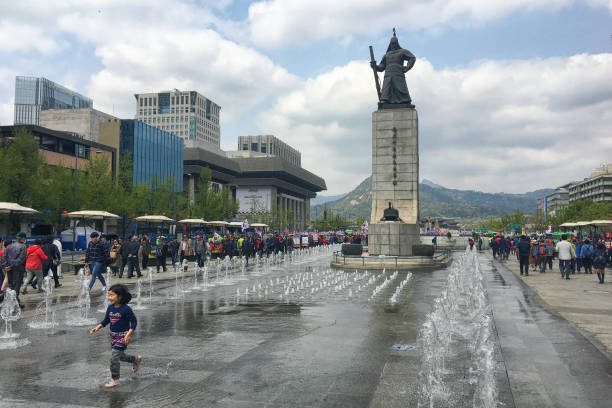 Gwanghwamun Square and The statue of Admiral Yi Sun-sin Seoul, Korea - April 20th 2019, Its beautiful spring day, peoples gathering on Gwanghwamun square and the statue of Admiral Yi Sun-sin for the protest, Seoul Korea. korean baby stock pictures, royalty-free photos & images