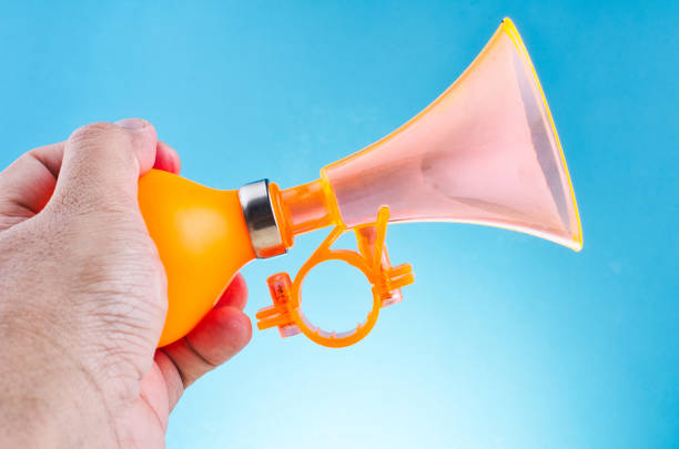 plastic and rubber material bike horn for warning or announce object over beautiful reverberation gradient background
