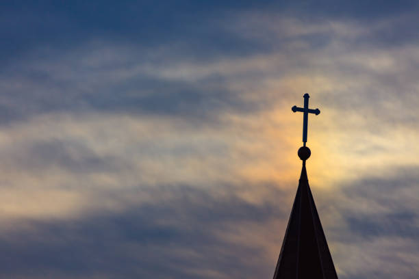 istock Beautiful sunset and sea Catholic church 1145724260