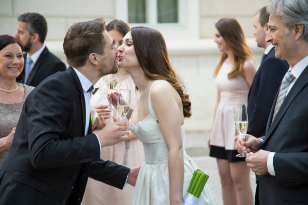 istock Bride and groom kissing at the wedding 1145725032