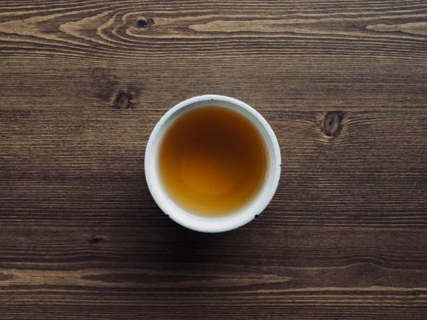Tea on wooden boards and porcelain cups, black tea