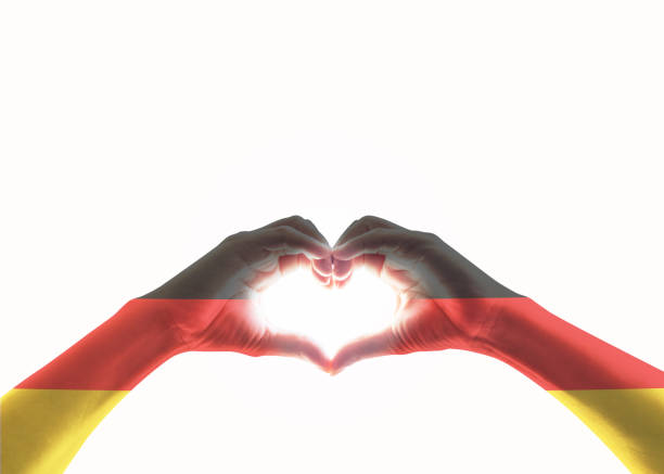 Germany national flag on people heart shape hands.