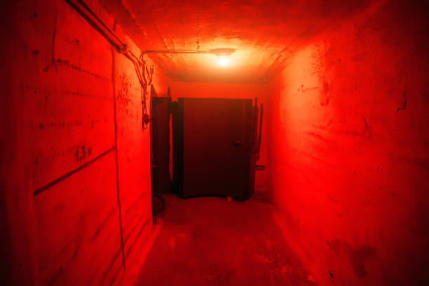 istock Hermetic armored door Soviet bunker inside and red light 1145730566