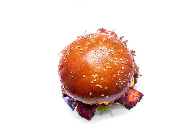 istock Juicy beef burger with bacon, cheese and salad. Close-up. 1145730577