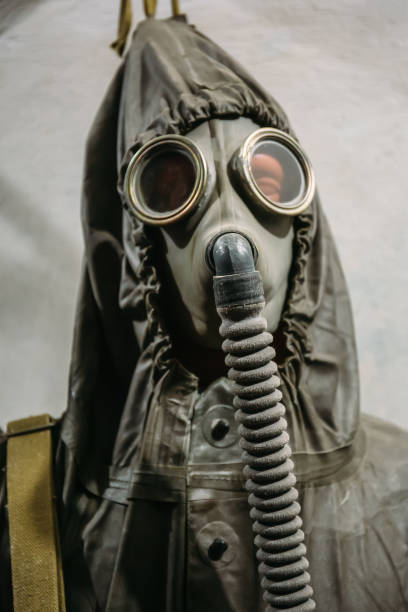 istock Vintage Soviet gas mask and radioactive protection uniform suit 1145730633
