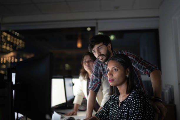 istock Dedicated team reunited working late at office 1145730762