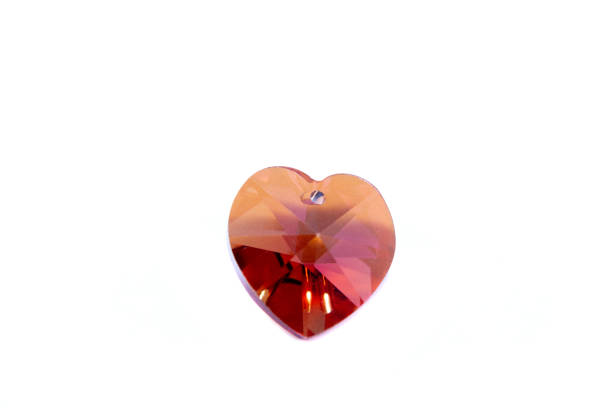 istock Glass heart close up on a white background 1145731374