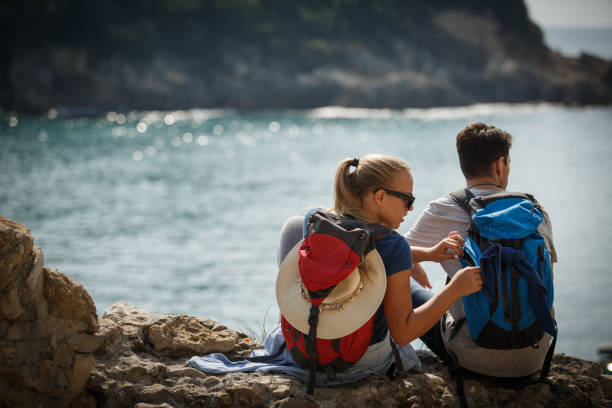 istock Hikers resting by the sea 1145733481