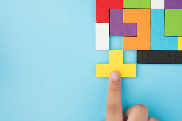 istock Hand push last piece jigsawto finish success planning concept solve puzzle isolated on blue background top view , logical thinking 1145740788
