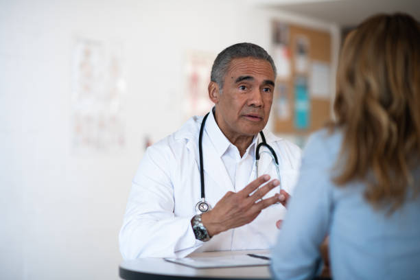 istock Male doctor talking to his patient 1145741447