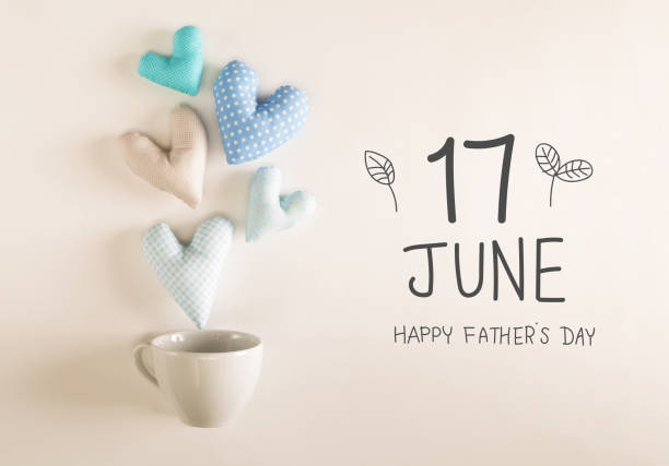 istock Father's Day message with blue heart cushions 1145744003