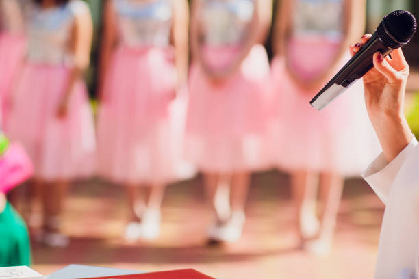 istock Master ceremony speech on microphone background wedding couple. microphone on the background of bridesmaids 1145746121