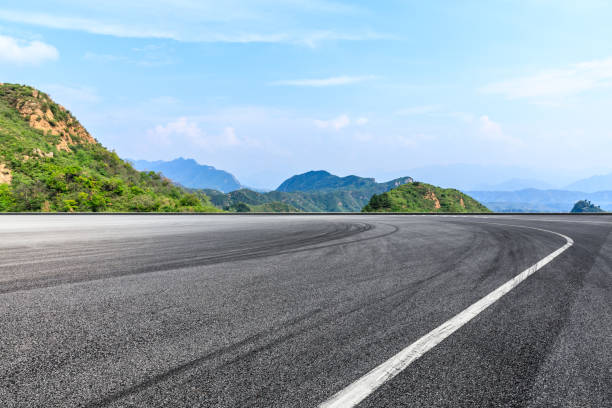 istock Asphalt race track and beautiful natural landscape 1145751740