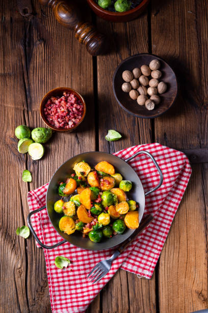 istock Brussels sprouts potato pan with bacon in rustic style 1145754277