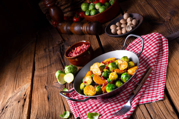 istock Brussels sprouts potato pan with bacon in rustic style 1145754385
