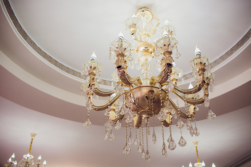 Close-up of a beautiful crystal chandelier under ceiling