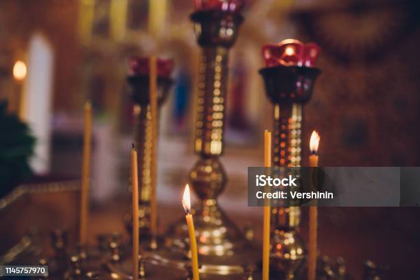 Ambiance Church Candles And Bokeh Yellow Lights Stock Photo - Download Image Now - Backgrounds, Candle, Candlelight