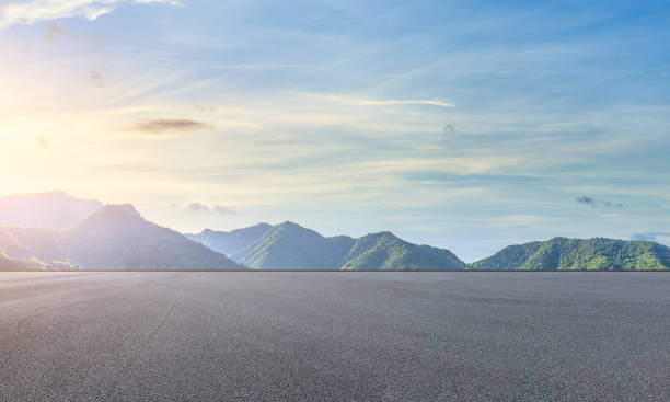 istock Asphalt race track and beautiful natural landscape at sunset 1145761936