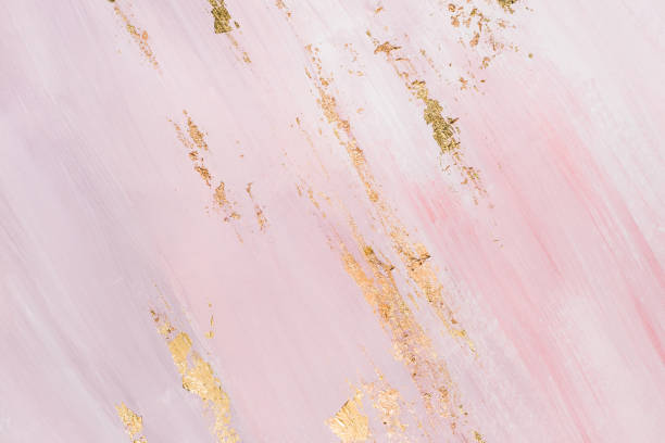istock Golden brushstrokes on gentle pinkish background. Creatively painted background 1145764222