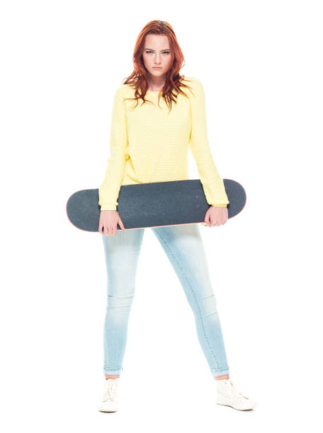 istock Cute female holding a skateboard 1145766422