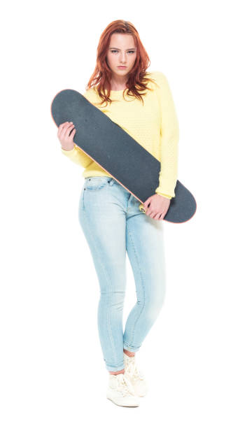 istock Cute female holding a skateboard 1145766693