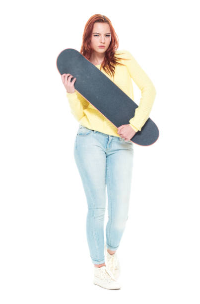 istock Cute female holding a skateboard 1145766695