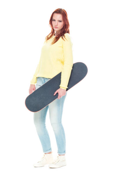 istock Cute female holding a skateboard 1145766799