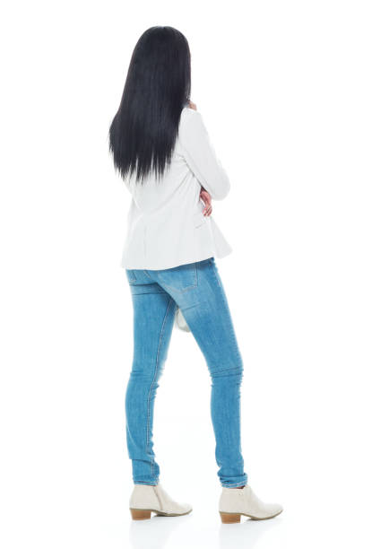 Beautiful latino female wearing a jacket and jeans - is thinking
