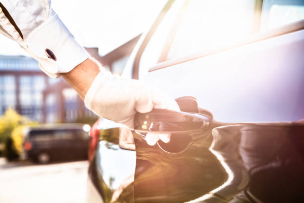 istock Male Valet Opening Car Door 1145767317