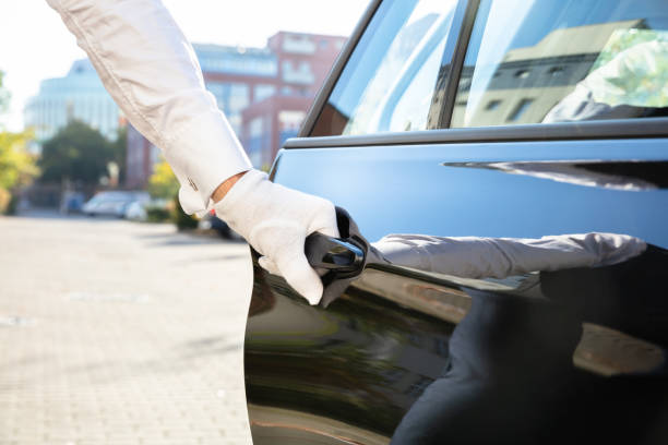 istock Male Valet Opening Car Door 1145767318