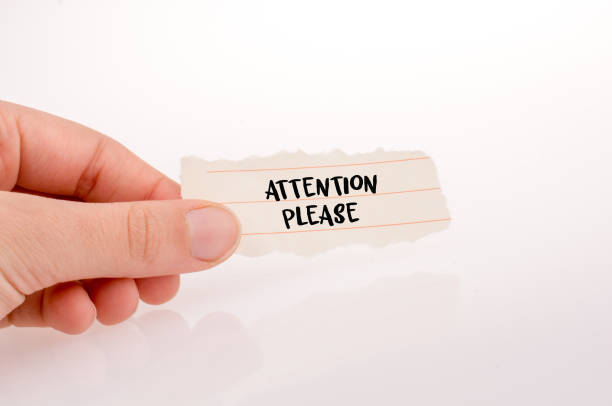 istock Hand holding paper with attention wording 1145769021