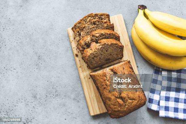 Banana Bread Loaf On Concrete Background Top View Stock Photo - Download Image Now - Banana Bread, Banana, Bread