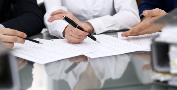 istock Bookkeepers team or financial inspectors  making report, calculating or checking balance. Group of people at work. Business operations concept 1145773735