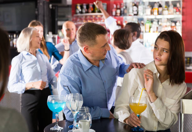 Woman gesturing stop to male Disgruntled young woman gesturing stop to male colleague flirting with her during firms party vex nightclub stock pictures, royalty-free photos & images