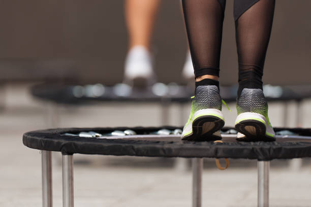 istock Fitness women jumping on small trampolines 1145775455