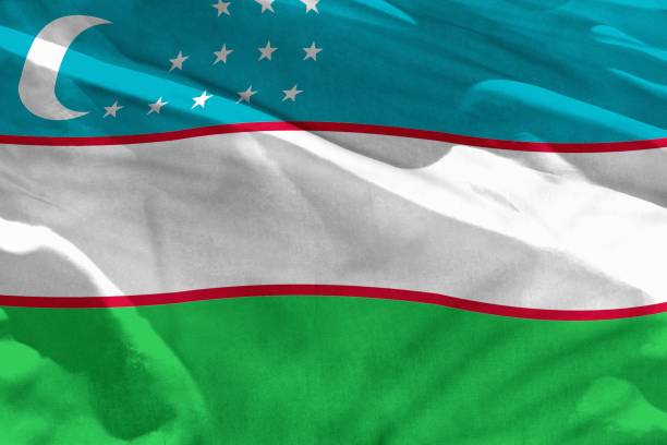 istock Waving Uzbekistan flag for using as texture or background, the flag is fluttering on the wind 1145775740