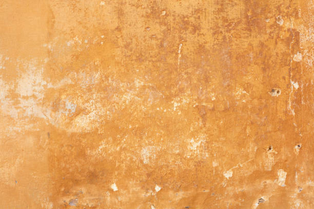istock Old yellow faded wall texture background 1145776600