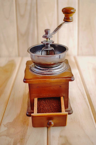 istock vintage Coffee grinder on wood table. 1145777123