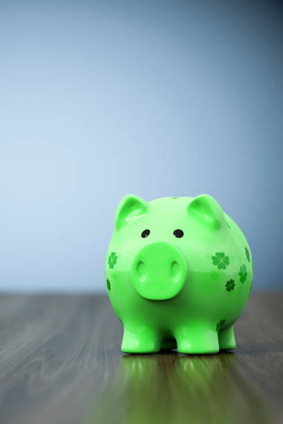 istock green clover piggy bank background 1145778577