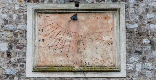 istock Ancient Antique Sun Dial on a Medieval Tower in Italy 1145778843