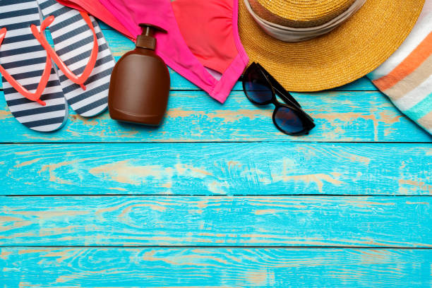 istock Composition with swimsuit on color wooden background 1145783133