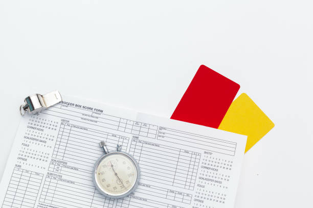 istock two penalty cards and a whistle for the referee 1145783326