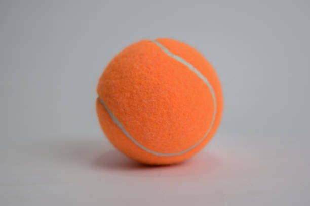 istock Close up tennis ball isolated on white background 1145783496